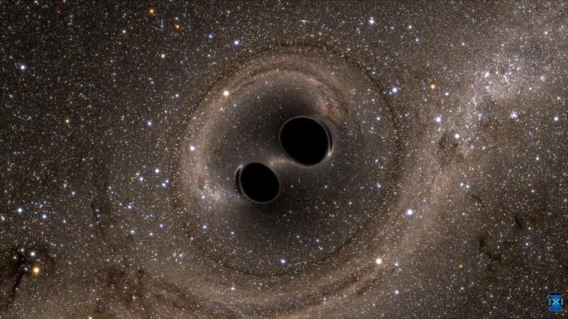 A simulation of two black holes colliding, a process that is thought to cause grativational waves. Courtesy the SXS (Simulating eXtreme Spacetimes) project.