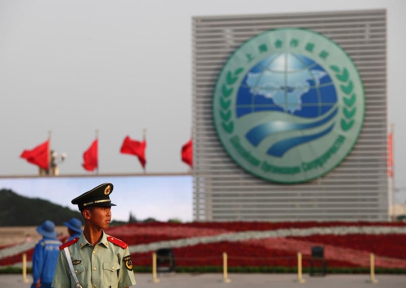 A paramilitary policeman in front of the Shanghai Cooperation Organisation logo at Tiananmen Square in Beijing. The SCO might yet prove a useful forum within which to discuss security. ChinaFotoPress / Getty Images. 