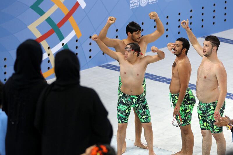 DUBAI , UNITED ARAB EMIRATES , March 20 – 2019 :- Left to Right - Omer Alshami ( front ), Abdullah Al Tajer (behind Omer ) , Awadh Alketbi and Khalid Albarguthi  celebrating after winning the 4x50m freestyle relay at the Special Olympic games held at Hamdan Sports Complex in Dubai. UAE won the bronze.  ( Pawan Singh / The National ) For News/Instagram/Online/Big Picture . Story by Ramola