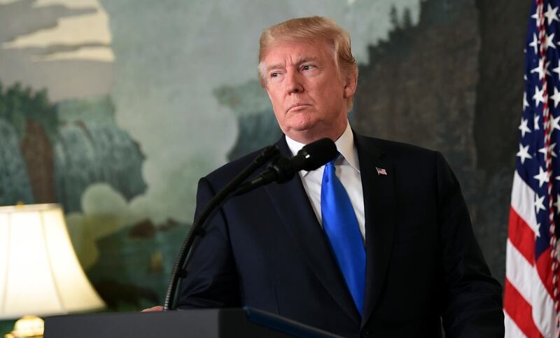 President Donald Trump arrives to speak about Iran from the Diplomatic Reception Room at the White House in Washington, Friday, Oct. 13, 2017. Trump says Iran is not living up to the "spirit" of the nuclear deal that it signed in 2015, and announced a new strategy in the speech. He says the administration will impose additional sanctions on the regime to block its financing of terrorism. (AP Photo/Susan Walsh)