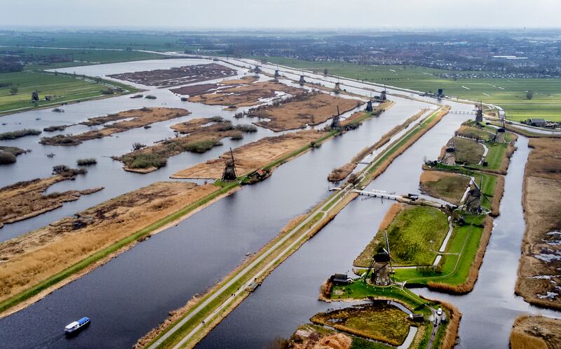 Wind pumps in Kinderdijk, Netherlands. The pumps prevent the region from being flooded, since a third of the Netherlands lies below sea level. AP Photo