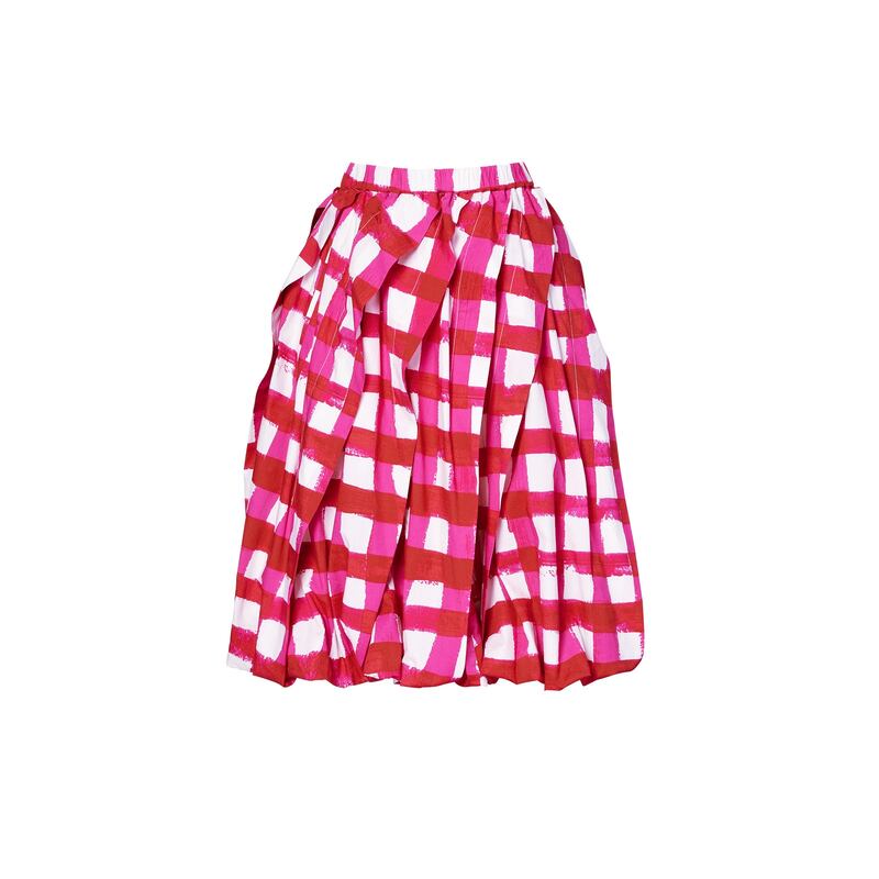 A deconstructed pleated skirt in pink and red.