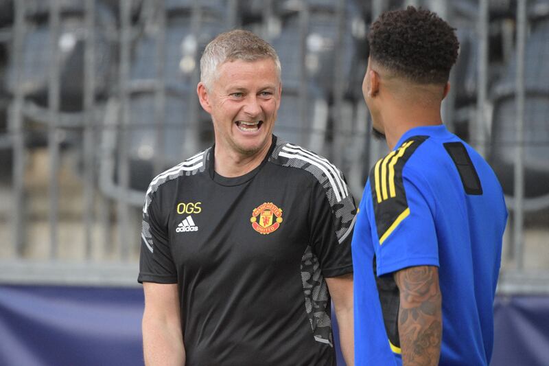 Ole Gunnar Solskjaer and Jadon Sancho. AFP