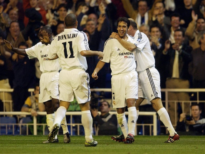 MADRID - APRIL 8:  Raul of Real Madrid celebrates scoring the second goal with team-mates Ronaldo and Zinedine Zidane during the UEFA Champions League quarter-final first leg match between Real Madrid and Manchester United held on April 8, 2003 at the Santiago Bernabeu Stadium, in Madrid, Spain. Real Madrid won the match 3-1. (Photo by Shaun Botterill/Getty Images)