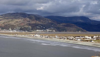 Mandatory Credit: Photo by Paul Lewis/Shutterstock (5586134k)
View of Fairbourne with Snowdonia and Barmouth in background
Village to be 'decommissioned' and abandoned to the sea, Fairbourne, Wales, Britain - 11 Feb 2016
Residents of a small Welsh village are preparing to fight plans to 'decommission' their home and abandon it to the sea. The local council have decided to abandon sea defences near to Fairbourne and allow the village to be taken by the sea. According to plans, the 500-home village will undergo 'managed realignment' and eventually be 'decommissioned' after the sea defences are abandoned in 40 years. A council document explains: "In the medium term over the next 50 years plans have to have been put in place and implemented to abandon defences and for the people to relocate. In the long term defences would not be maintained". According to local residents this has caused house prices to plummet, meaning they are unable to move, and damaged local businesses. They are preparing for a legal fight saying that the plans are based on the 'nonsensical' assumption that sea levels will rise by a whole metre in the next century