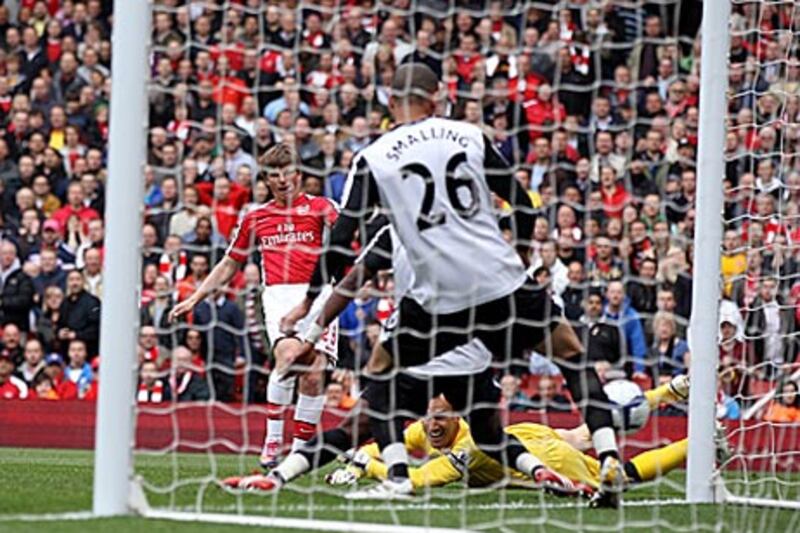Arsenal's Andrey Arshavin scores past Mark Schwarzer, the Fulham goalkeeper, to open the scoring in a 4-0 rout against their fellow Londoners at the Emirates Stadium yesterday.