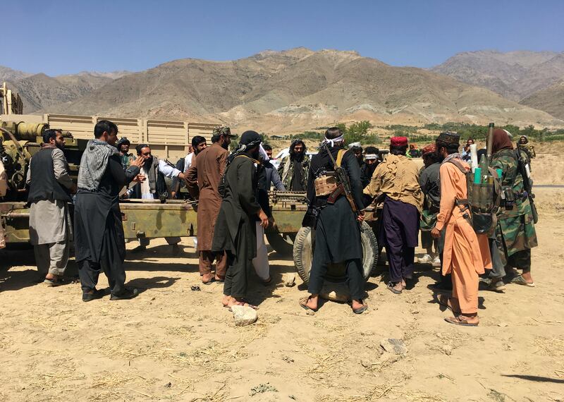 Weapons and other equipment are distributed among Taliban fighters in Panjshir. AP Photo