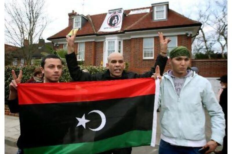 Members of a group calling themselves "Topple The Tyrants" outside a house belonging to Saif Qaddafi, the son of the Libyan dictator Muammar Qaddafi in Hampstead Garden Suburb, north London.