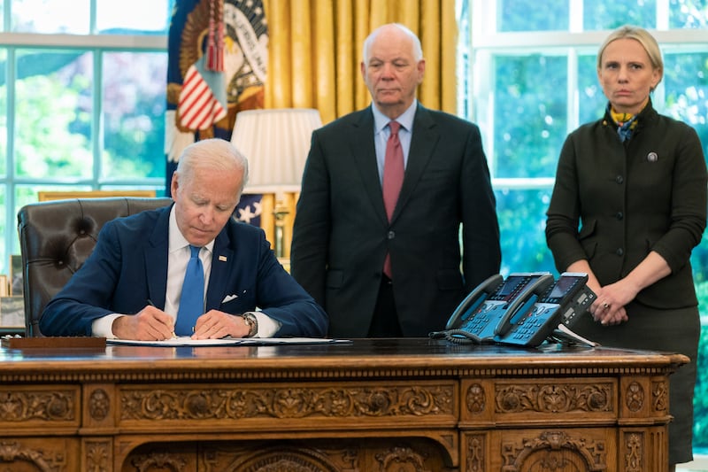 US President Joe Biden signs the Ukraine Democracy Defence Lend-Lease Act in the Oval Office of the White House in May 2022, with Mr Cardin and Ukraine-born House member Victoria Spartz. AP