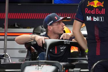 Dutch Formula One driver Max Verstappen (L) of Red Bull Racing speaks with team members in the team's garage in Suzuka, Japan, 21 September 2023.  The Formula 1 Japanese Grand Prix will take place on 24 September 2023.   EPA / FRANCK ROBICHON