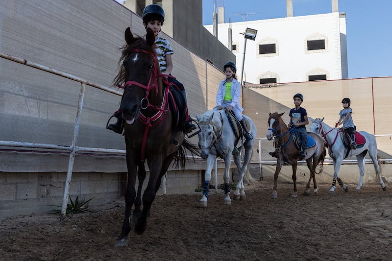 Children ride horses at Friends Equestrian Club.