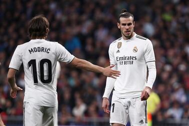 Soccer Football - La Liga Santander - Real Madrid v FC Barcelona - Santiago Bernabeu, Madrid, Spain - March 2, 2019 Real Madrid's Luka Modric shakes hands with Gareth Bale before the match REUTERS/Sergio Perez