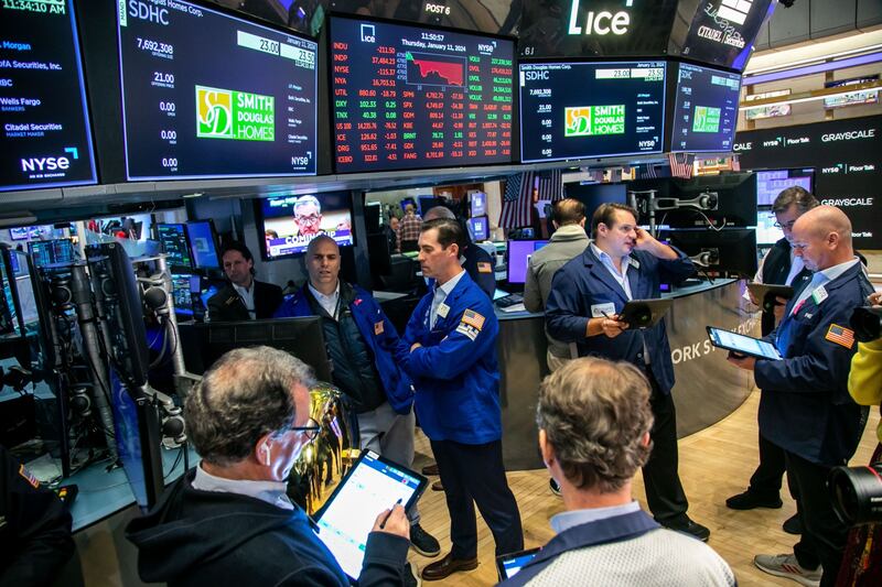 Traders on the floor of the New York Stock Exchange. The Dow Jones Industrial Average, S&P 500 and Nasdaq Composite have all gained 0.3 per cent so far in 2024. Bloomberg