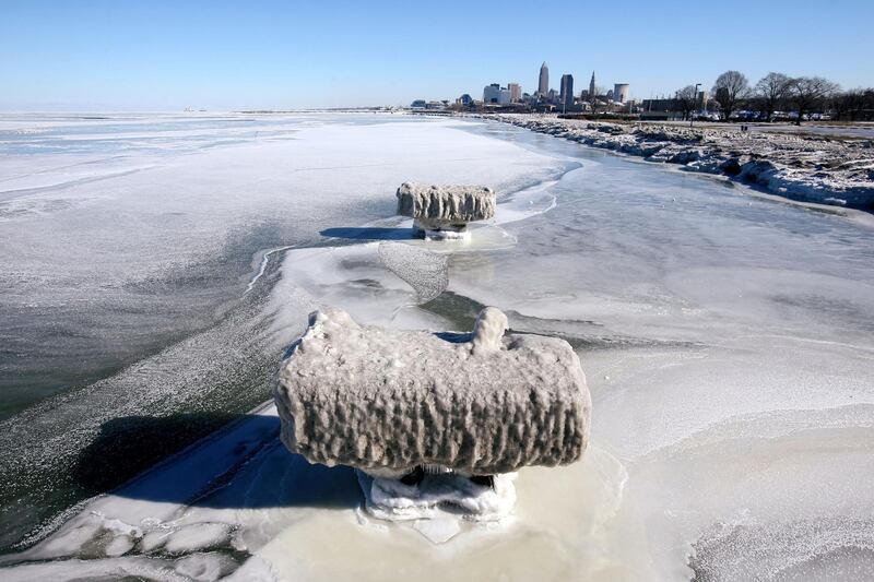 A view of the ice covered shoreline of Lake Erie with the Cleveland skyline in the background. Reuters
