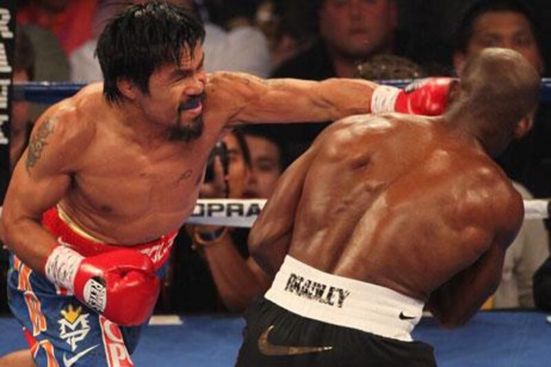 Manny Pacquiao lands a left to the head of Timothy Bradley during their WBO title bout in Las Vegas