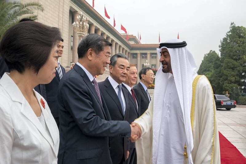 BEIJING, CHINA - July 22, 2019: HH Sheikh Mohamed bin Zayed Al Nahyan, Crown Prince of Abu Dhabi and Deputy Supreme Commander of the UAE Armed Forces (R) greets the Chinese delegation, during a reception at the Great Hall of the People.

( Mohamed Al Hammadi / Ministry of Presidential Affairs )
---