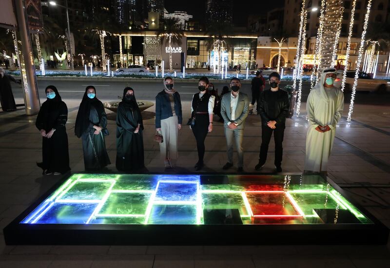 Dubai, United Arab Emirates - Reporter: N/A. News. Art. The artists with a representative from Dubai culture. Al Hai, a series of enthralling light installations adorning Downtown Dubai Boulevard. This piece is called Al Saha. Dubai. Thursday, January 5th, 2021. Chris Whiteoak / The National