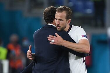 England's forward Harry Kane embraces England's coach Gareth Southgate as he leaves the pitch after being substituted during the UEFA EURO 2020 quarter-final football match between Ukraine and England at the Olympic Stadium in Rome on July 3, 2021.  (Photo by Ettore Ferrari  /  POOL  /  AFP)