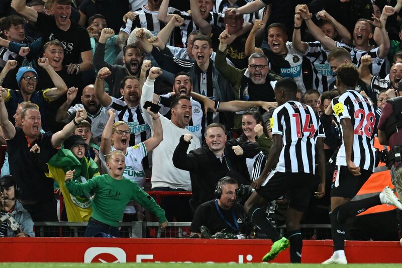 Newcastle striker Alexander Isak celebrates scoring in front of the away fans. AFP