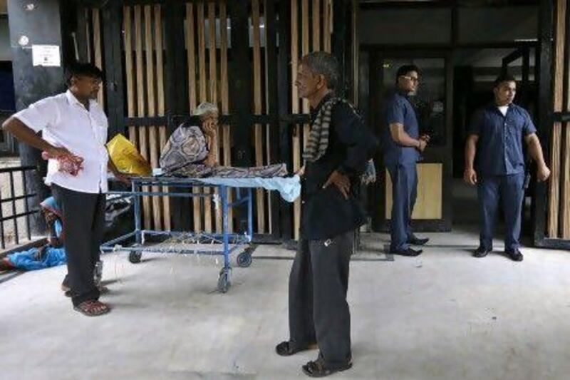 Bouncers stand guard at the Deen Dayal Upadhyay Hospital in New Delhi, India. The hospital has hired more than 20 security guards to protect its staff.