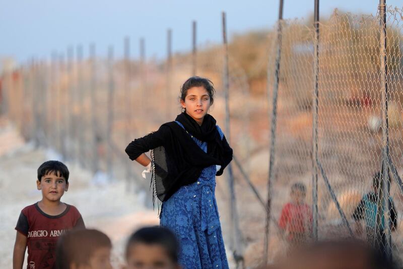 FILE PHOTO: Newly displaced Syrian children arrive to a refugee camp in Atimah village, Idlib province, Syria September 11, 2018. REUTERS/ Khalil Ashawi/File Photo