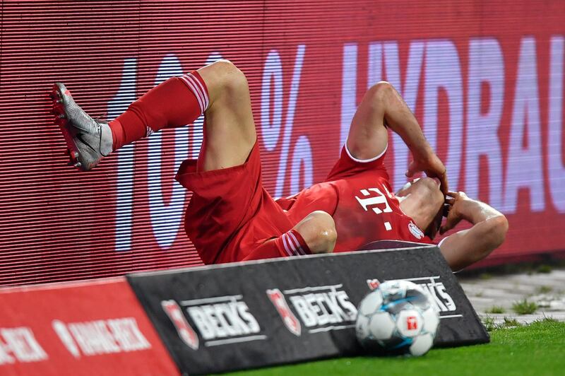 Lewandowski grimaces in pain after a foul by Bremen's Sebastian Langkamp. AP