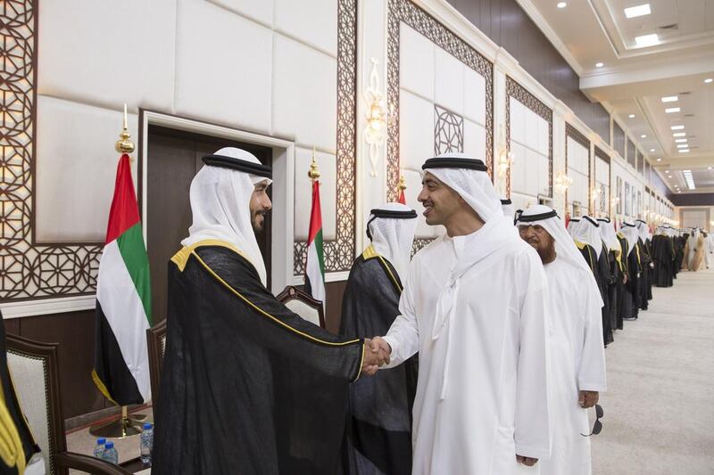 Sheikh Abdullah bin Zayed, Minister of Foreign Affairs and International Cooperation, greets grooms during a group wedding at Mushrif Palace. Ryan Carter / Crown Prince Court - Abu Dhabi