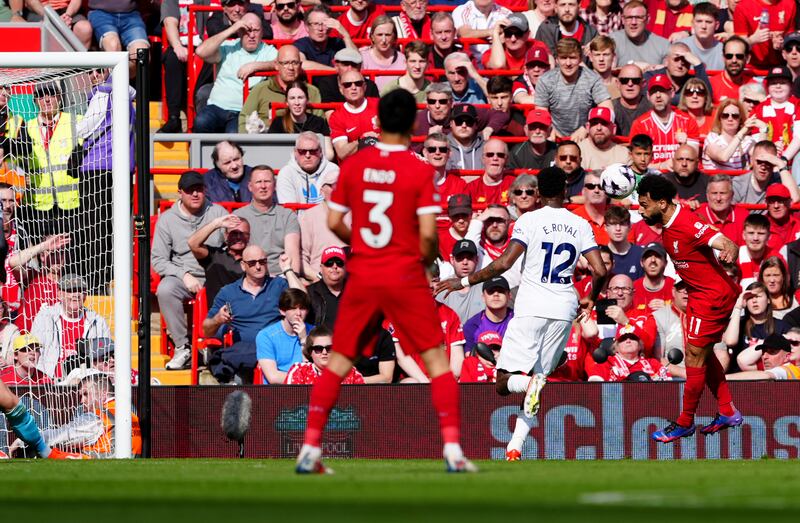 Liverpool's Mohamed Salah heads in the first goal. PA
