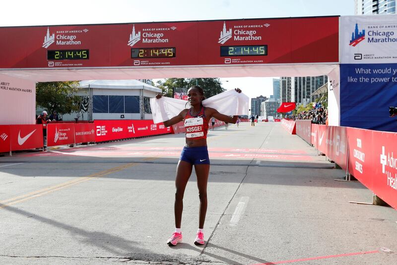 Kenya's Brigid Kosgei celebrates winning the Chicago women's marathon, setting a new world record. Reuters