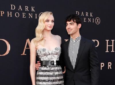 FILE PHOTO: Actor Sophie Turner poses with her husband Joe Jonas at the premiere for the film "Dark Phoenix" in Los Angeles, California, U.S., June 4, 2019. REUTERS/Mario Anzuoni/File Photo