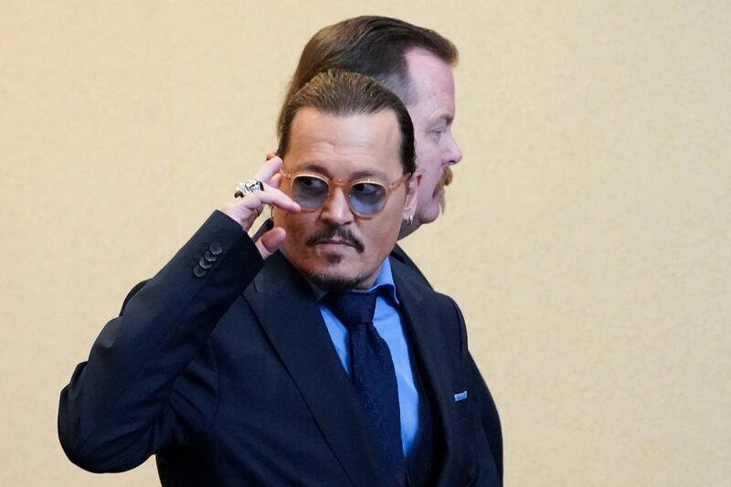 Depp leaves the courtroom during a break. AFP