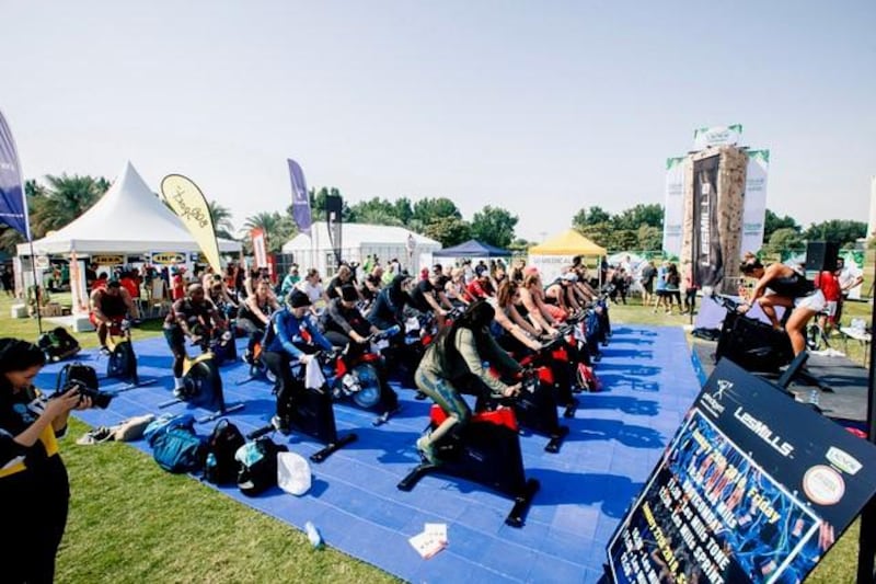Participants at an RPM group fitness class at Yas Fitness Festival