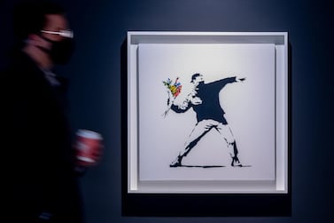 Sotheby's will accept cryptocurrency as payment for Banksy's Love is in the Air, which will be auctioned at a contemporary art event on May 12. Image courtesy of Sotheby's