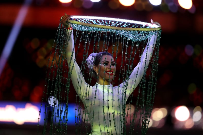 A woman performs during the opening ceremony at the Super Cup.