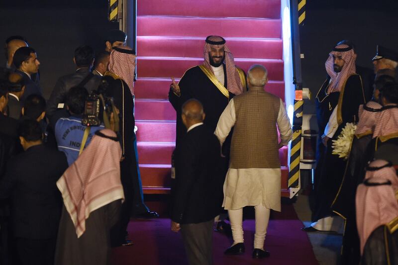 Indian Prime Minister Narendra Modi welcomes Saudi Crown Prince Mohammed bin Salman as he arrives at the airport in New Delhi. AFP