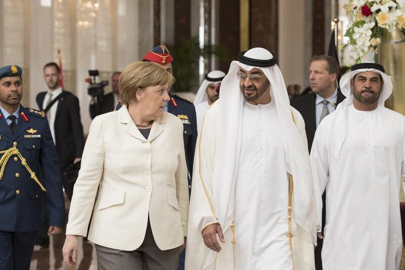 Sheikh Mohammed bin Zayed, Crown Prince of Abu Dhabi and Deputy Supreme Commander of the Armed Forces, greets German chancellor Angela Merkel on her arrival in Abu Dhabi for a state visit. Ryan Carter / Crown Prince Court – Abu Dhabi 