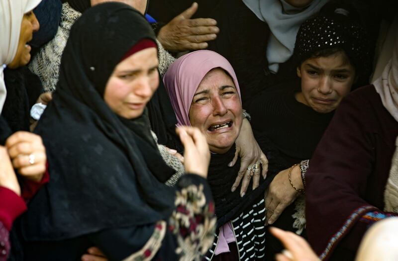 The mother (C) of Badr Nafla, 19, who died after reportedly being shot by Israeli forces in the neck in the midst of confrontations near the northern West Bank city of Tulkarem yesterday, reacts during his funeral in the same city.  AFP