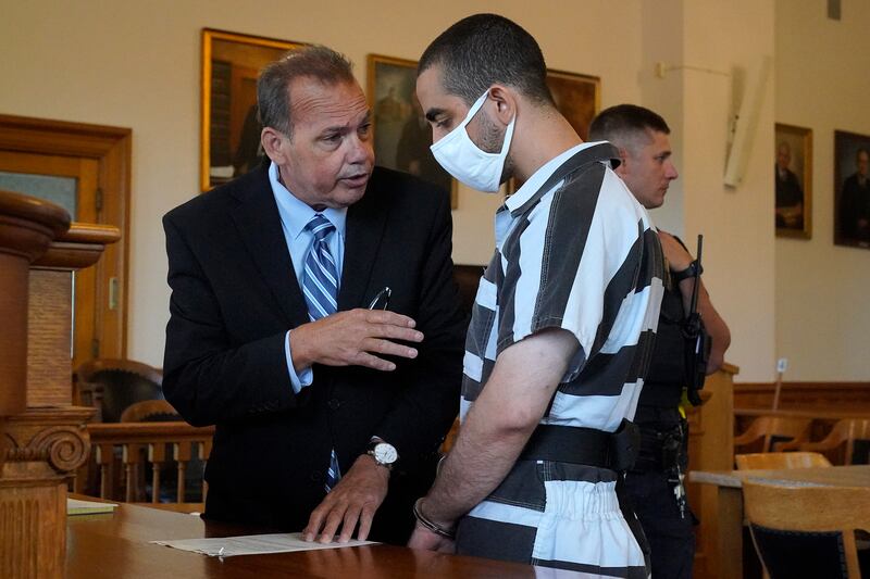 Nathaniel Barone, defence attorney for Hadi Matar, talks with his client. AP