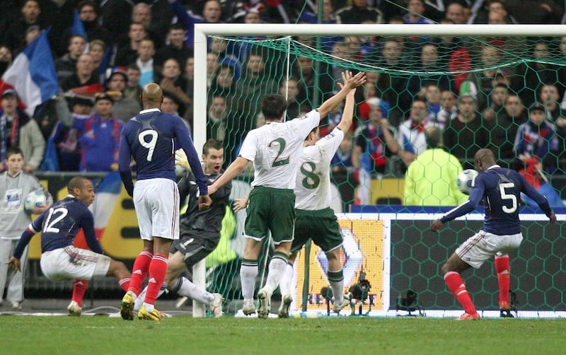 In this November 18, 2009 photo, France's William Gallas, second right, scores the winning goal after being set up by Thierry Henry and his controversial uncalled hand ball in the World Cup qualifying play-off against Ireland that allowed France to reach the 2010 World Cup Finals.