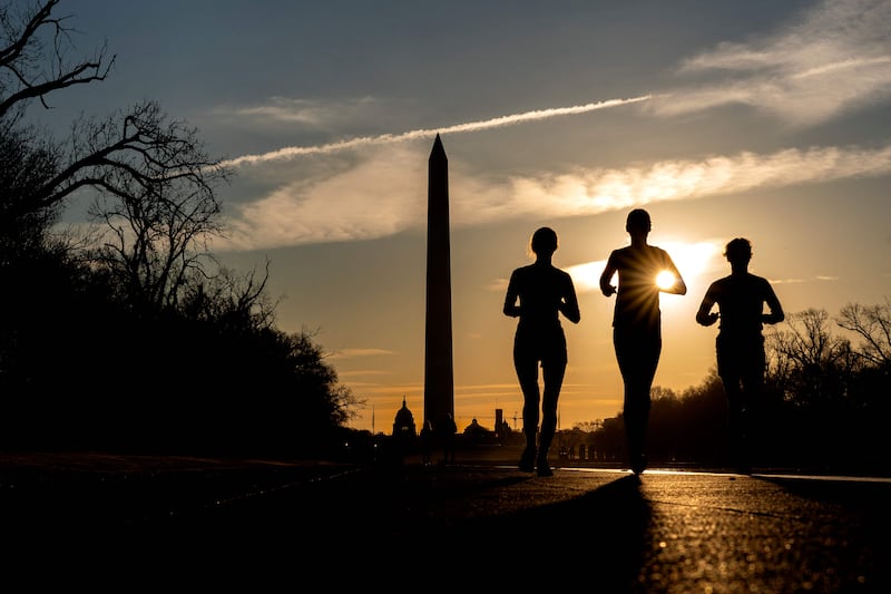 A low-key workout or light jog 90 minutes before sunset means you can reap the benefits of exercising on an empty stomach and replenish yourself with water soon after. AFP