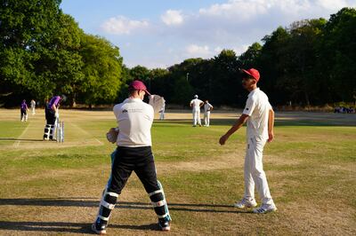 Afghan refugee boys playing in a cricket match in Fulham, London.  Victoria Pertusa / The National