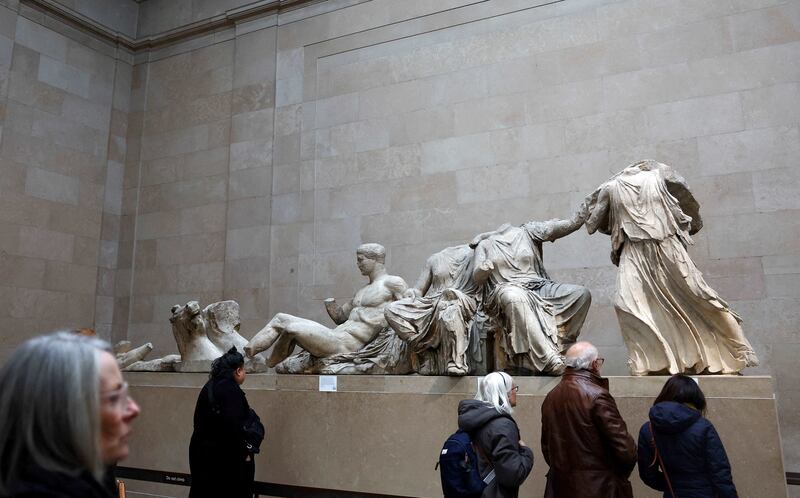 People view examples of the Parthenon sculptures known in the UK as the Elgin Marbles at the British Museum in London. Reuters