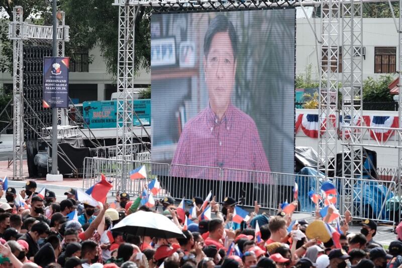 A promotional video for Mr Marcos Jr is displayed on a screen at the Old Legislative Building, in Manila. Bloomberg