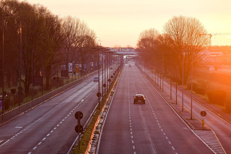 A picture taken on March 8, 2020 shows an empty road leading to Linate Airport in Milan, after millions of people were placed under forced quarantine in northern Italy as the government approved drastic measures in an attempt to halt the spread of the deadly coronavirus that is sweeping the globe. - On top of the forced quarantine of 15 million people in vast areas of northern Italy until April 3, the government has also closed schools, nightclubs and casinos throughout the country, according to the text of the decree published on the government website. With more than 230 fatalities, Italy has recorded the most deaths from the COVID-19 disease of any country outside China, where the outbreak began in December. (Photo by Piero CRUCIATTI / AFP)