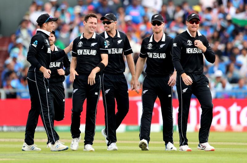 Henry, third left, celebrates with teammates the dismissal of India's Rohit Sharma. AP Photo