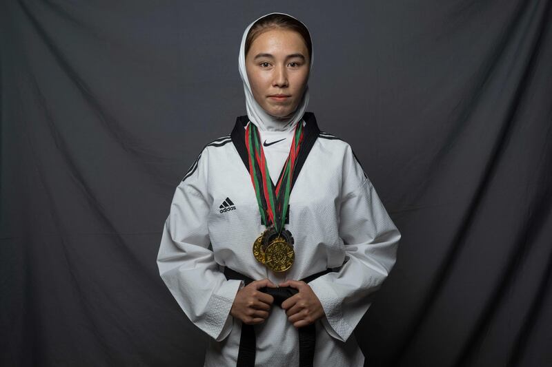 Taekwondo athlete Zarghunna Noori, 23, poses for a portrait in Herat.