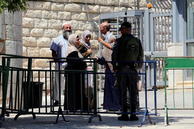 An Israeli border police officer stop Palestinians at a checkpoint before a visit by Israeli Prime Minister Benjamin Netanyah, in Hebron in the Israeli-occupied West Bank.  Reuters