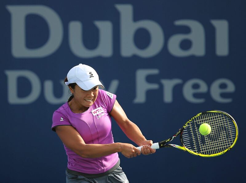 epa03589779 Kurumi Nara of Japan returns the ball to Urszula Radwanska of Poland during their qualifying round match of the Dubai Duty Free Tennis Championships in Dubai, United Arab Emirates, 18 February 2013.  EPA/ALI HAIDER *** Local Caption ***  03589779.jpg