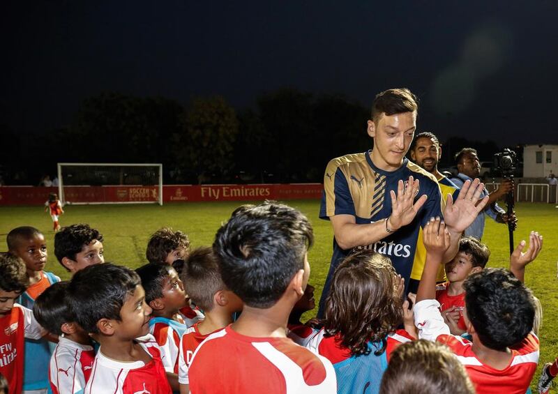 Mesut Ozil made his comments regarding his Arsenal future during a visit to the Arsenal Soccer School in Dubai. Victor Besa for The National