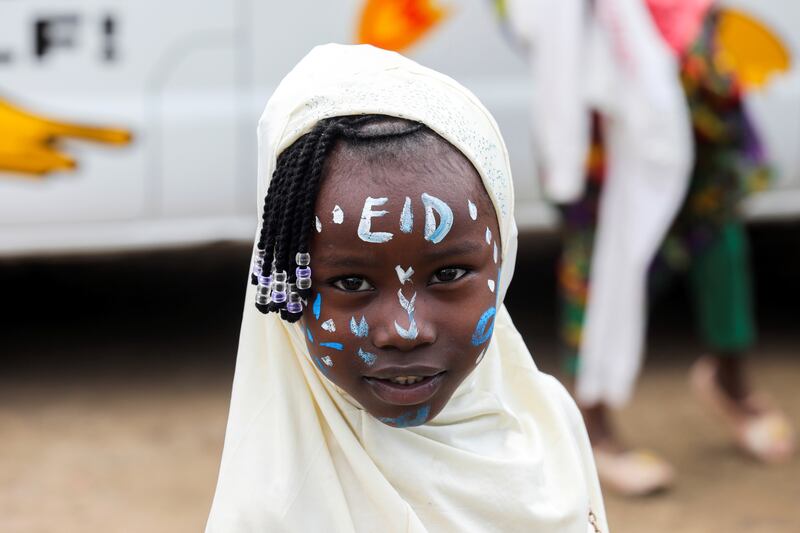 A girl celebrates Eid Al Adha in the Kibera slum in Nairobi, Kenya.